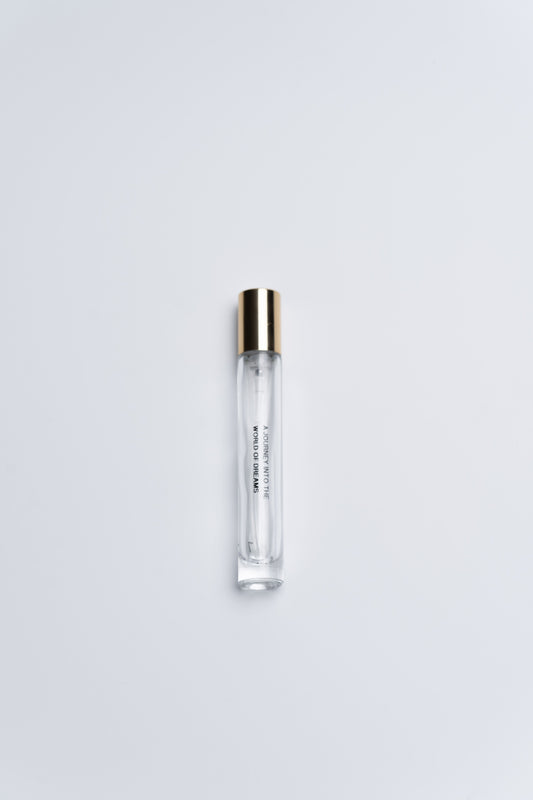 Clear plastic tube with gold cap on a white background